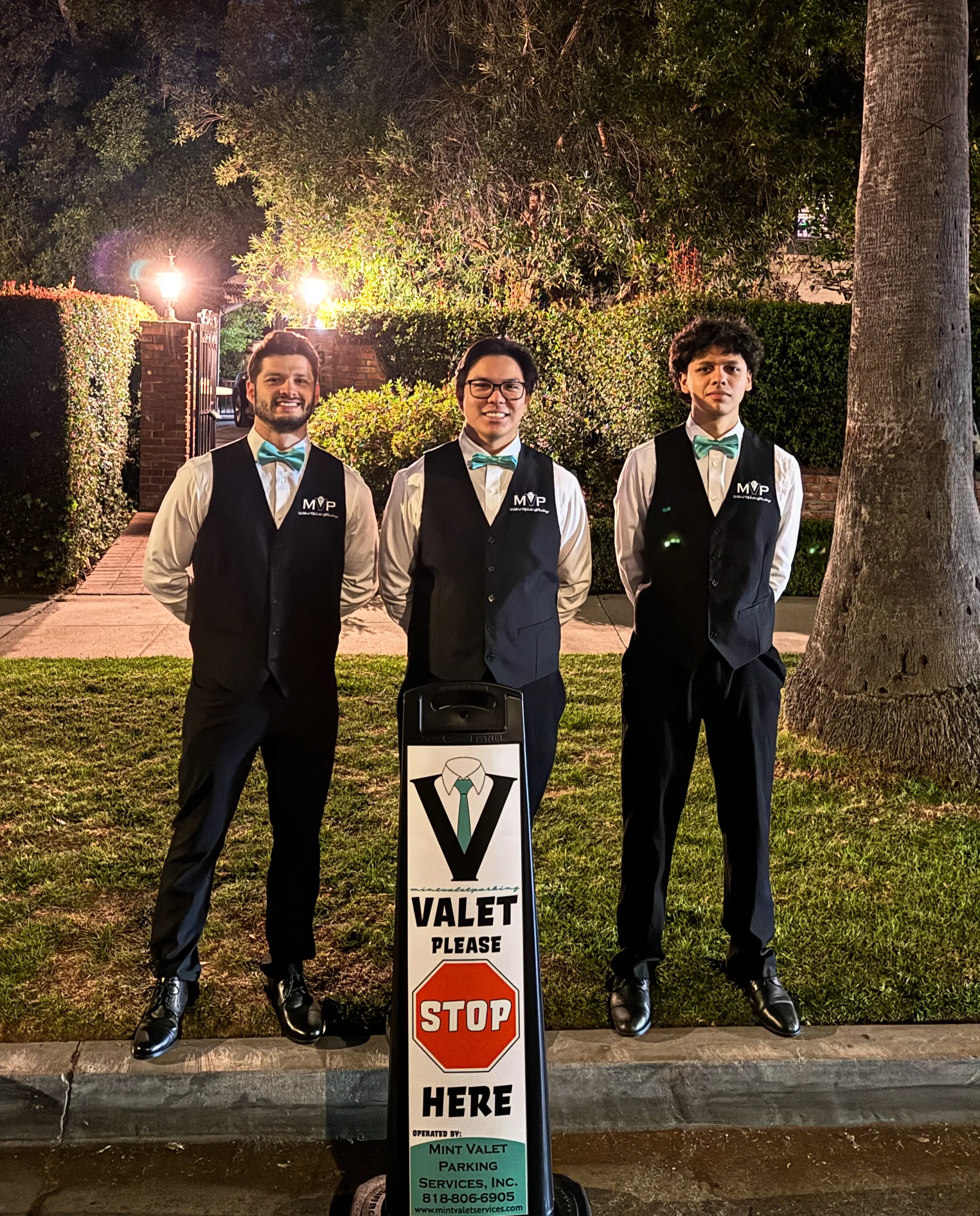 Mint Valet Parking Services attendants standing ready in front of Theoni Collection Beverly Hills showroom for the grand opening. Valet Parking Beverly Hills done right.
